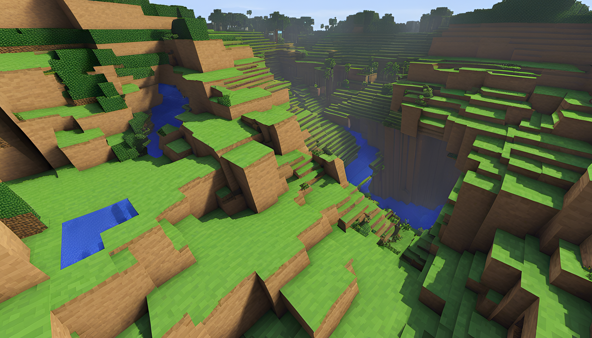 Minecraft landscape with towering mountains and lush green forests.