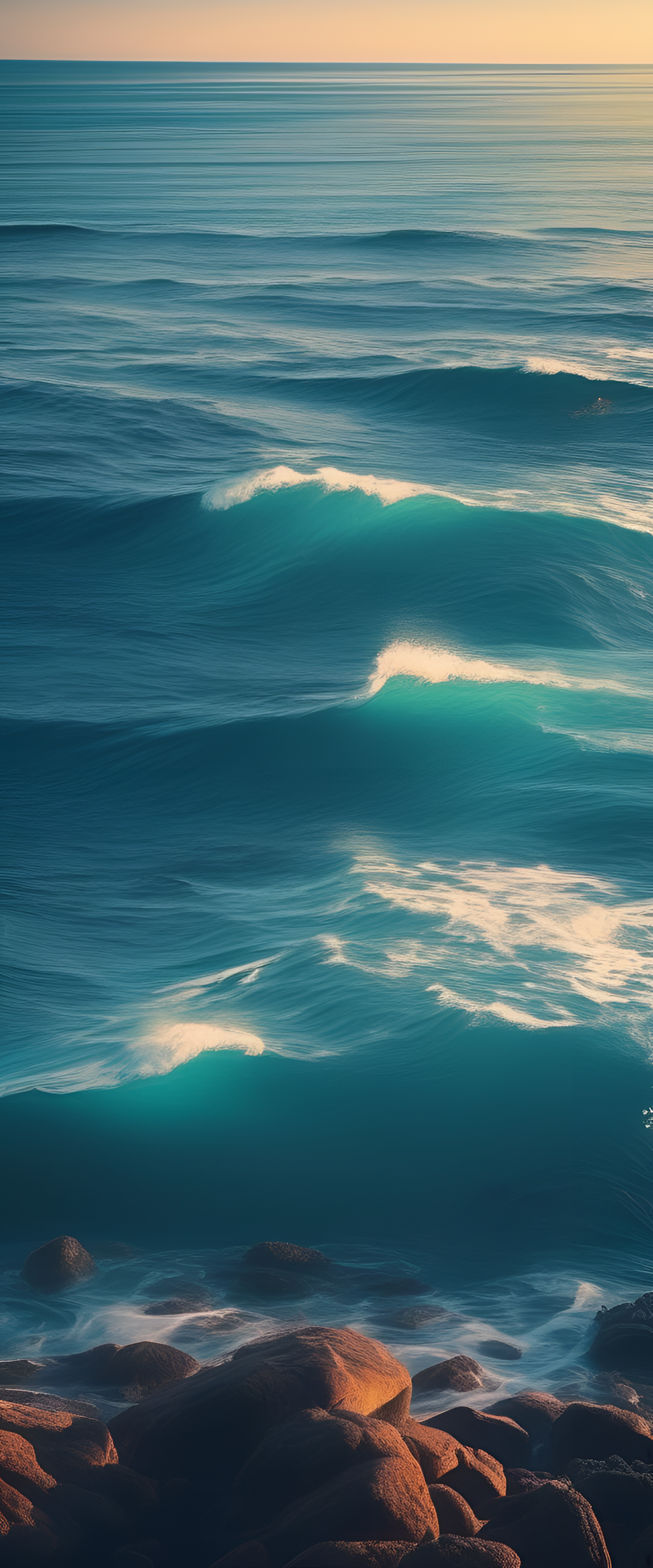 Serene ocean waves crashing on sandy beach with cloud-filled sky.