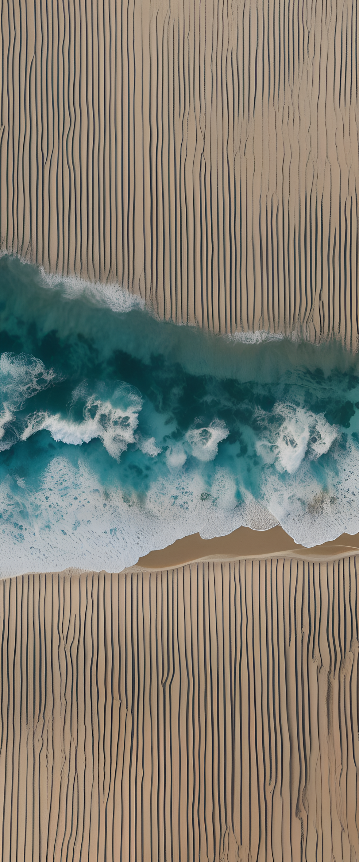 A serene blue ocean with waves gently crashing against a golden sandy beach.