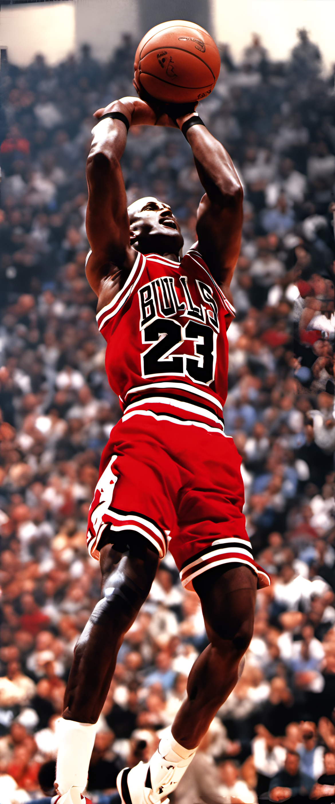 Michael Jordan in action, soaring through the air with a basketball in hand.