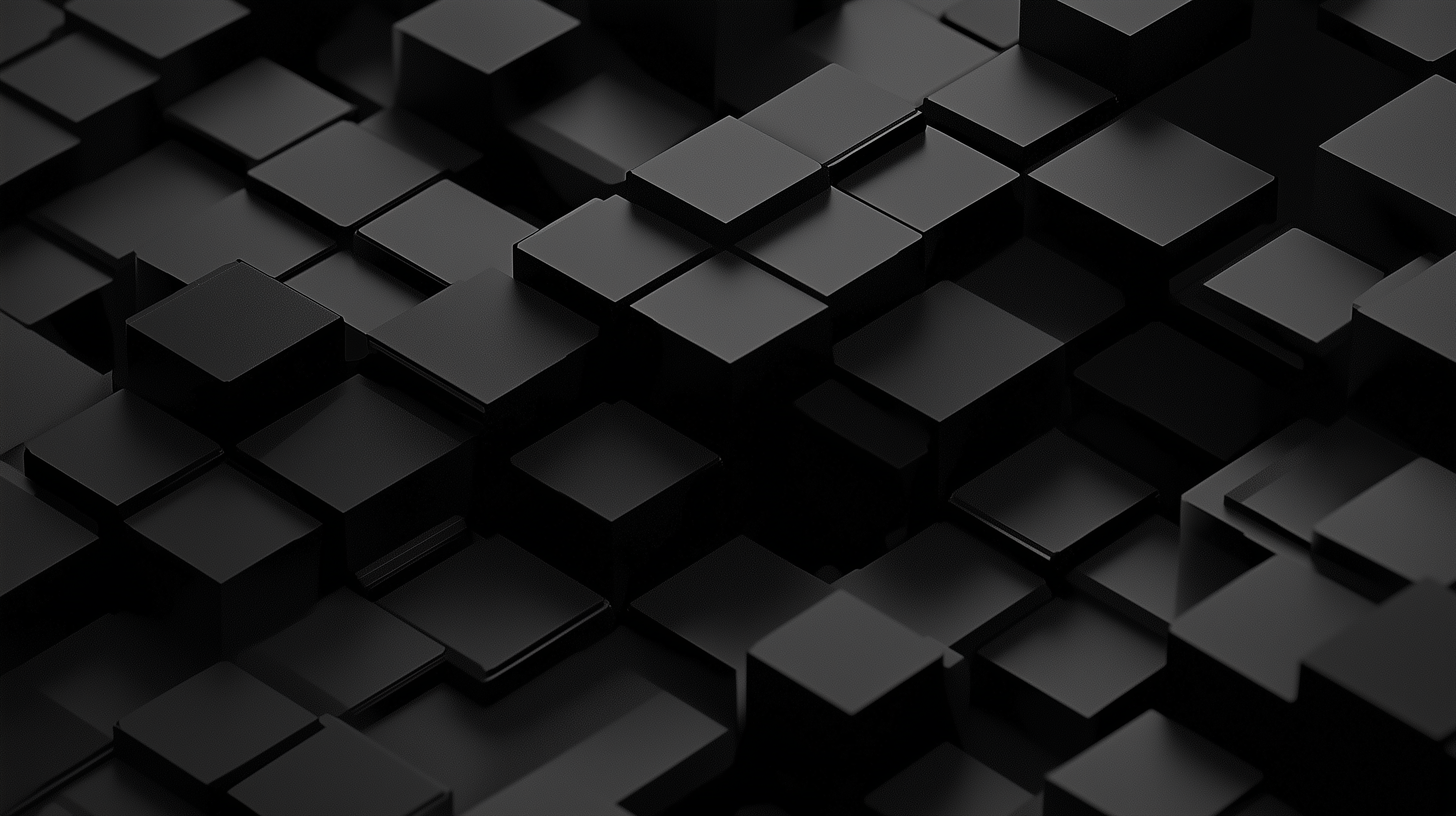 A three-dimensional arrangement of black cubes and rectangular shapes creates an artistic, textured surface, showcasing depth and contrast in a monochromatic design.