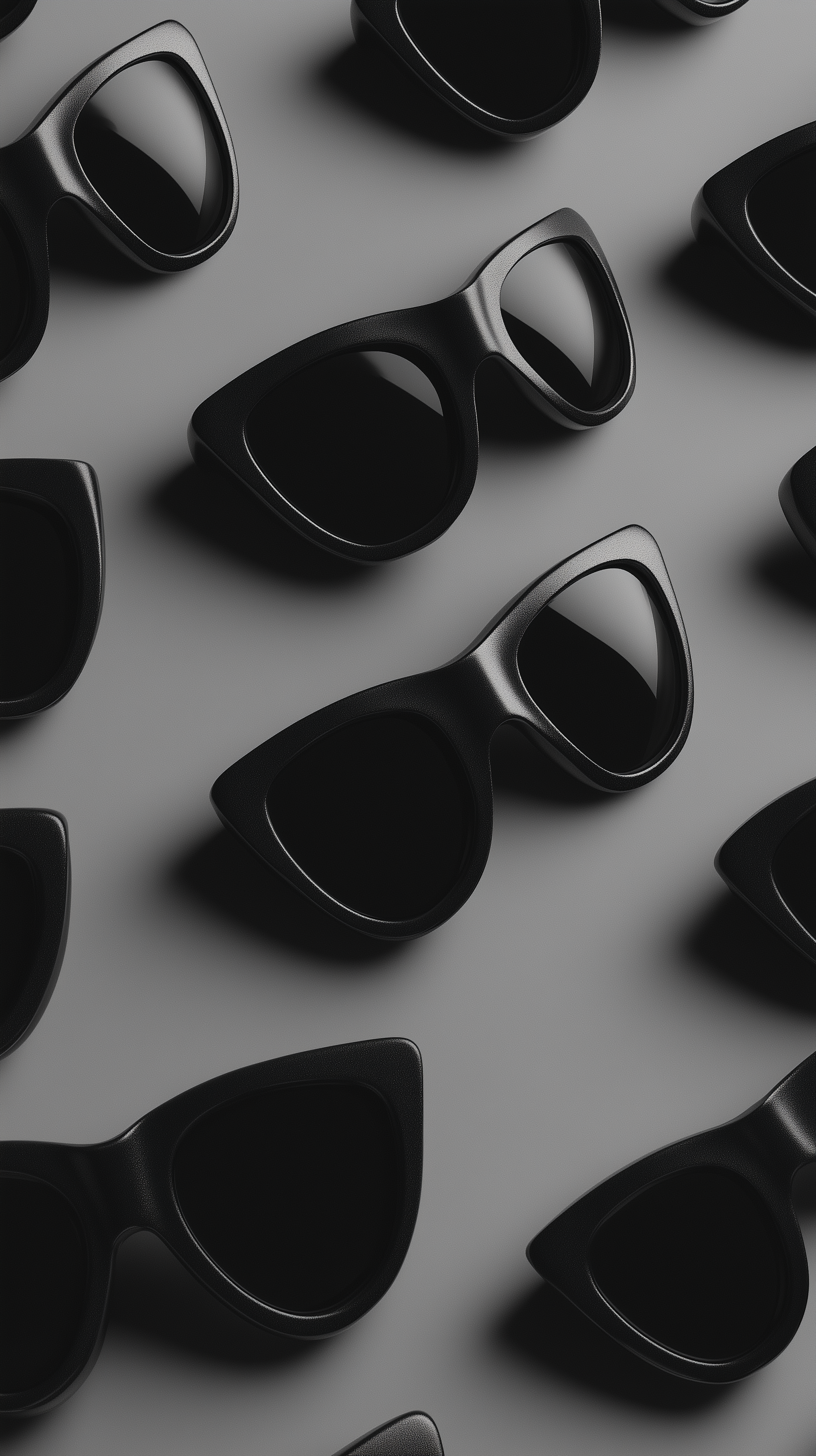 A collection of black sunglasses arranged stylishly on a sleek surface, showcasing a modern design, perfect for an HD iPhone wallpaper.