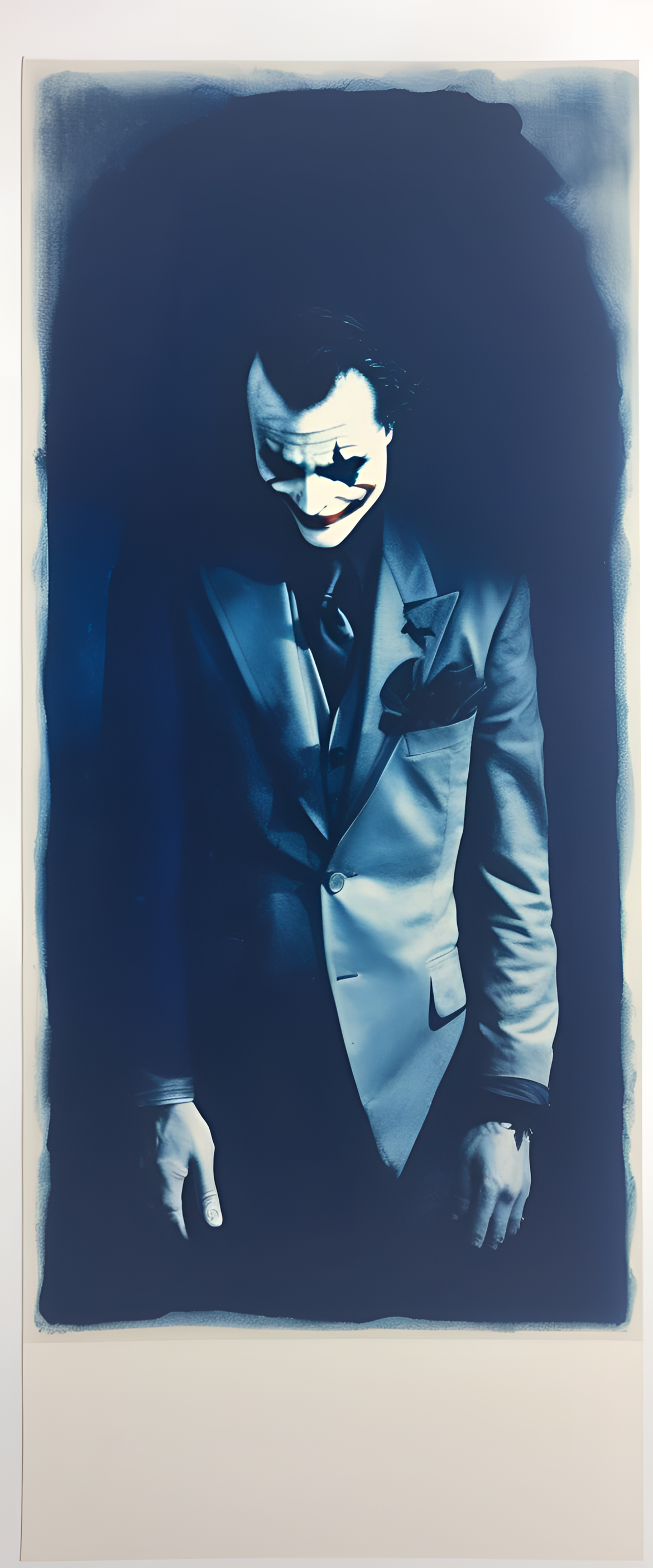 Cyanotype-print portrait of Joker on a phone wallpaper.